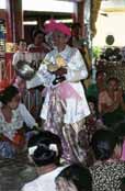 Woman is a medium who answering the questions. Nat festival. Myanmar (Burma).