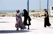 Woman at sea promenade. Busher. Iran.