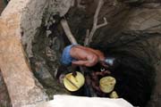 The water is retrieving from 10m deep well by men-chain to small reservoir. Men are singing for better synchronization. Singing well, Dublock. South, Ethiopia.