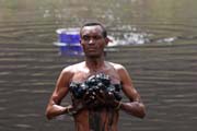 The salt is retrieving from the lake without any mechanization. Salt Lake, El Sod. South, Ethiopia.