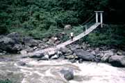 Crossing Baliem river using goverment bridge near Wamerek village. Papua, Indonesia.