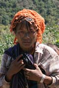 Woman from Munn Chin tribe. Traditional face tattoo continues even on her neck. Chin State. Myanmar (Burma).