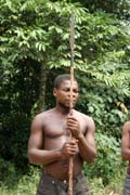 Pygmy hunter, village down to the Lobe River. The Pygmy people are gatherers and hunters. They hunt animals such as antelopes, pigs and monkeys, and also gather honey, wild yams, berries and other plants. Cameroon.
