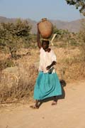 Water carying. Mountain village Djingliya at Mandara Mountains. Cameroon.