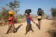 Water carying. Mountain village Djingliya at Mandara Mountains. Cameroon.