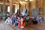 Local elementary school near camp with working elephants. Taungoo town area. Myanmar (Burma).