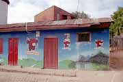 House and advertising to the french cheese Happy cow, Ambohimanga village. Madagascar.