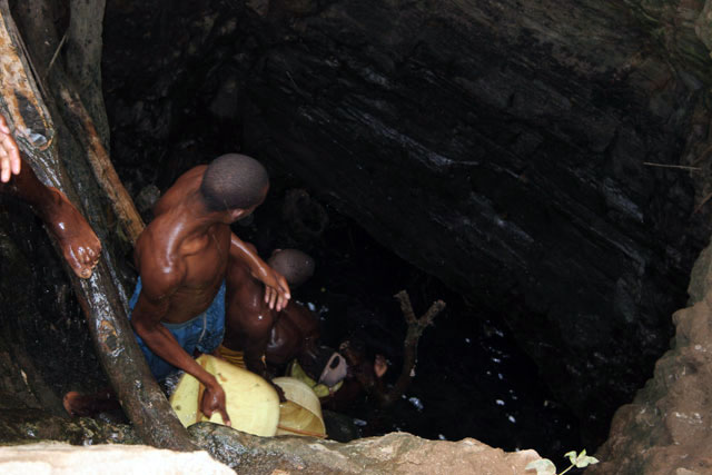 The water is retrieving from 10m deep well by men-chain to small reservoir. Men are singing for better synchronization. Singing well, Dublock. South,  Ethiopia.